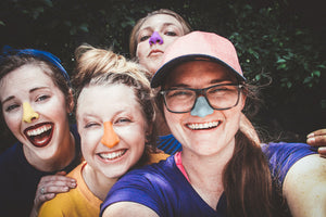  Happy mother and her kids look cool while wearing the best SPF, zinc oxide formula, reef-safe sunscreen on their noses, and big smiles.